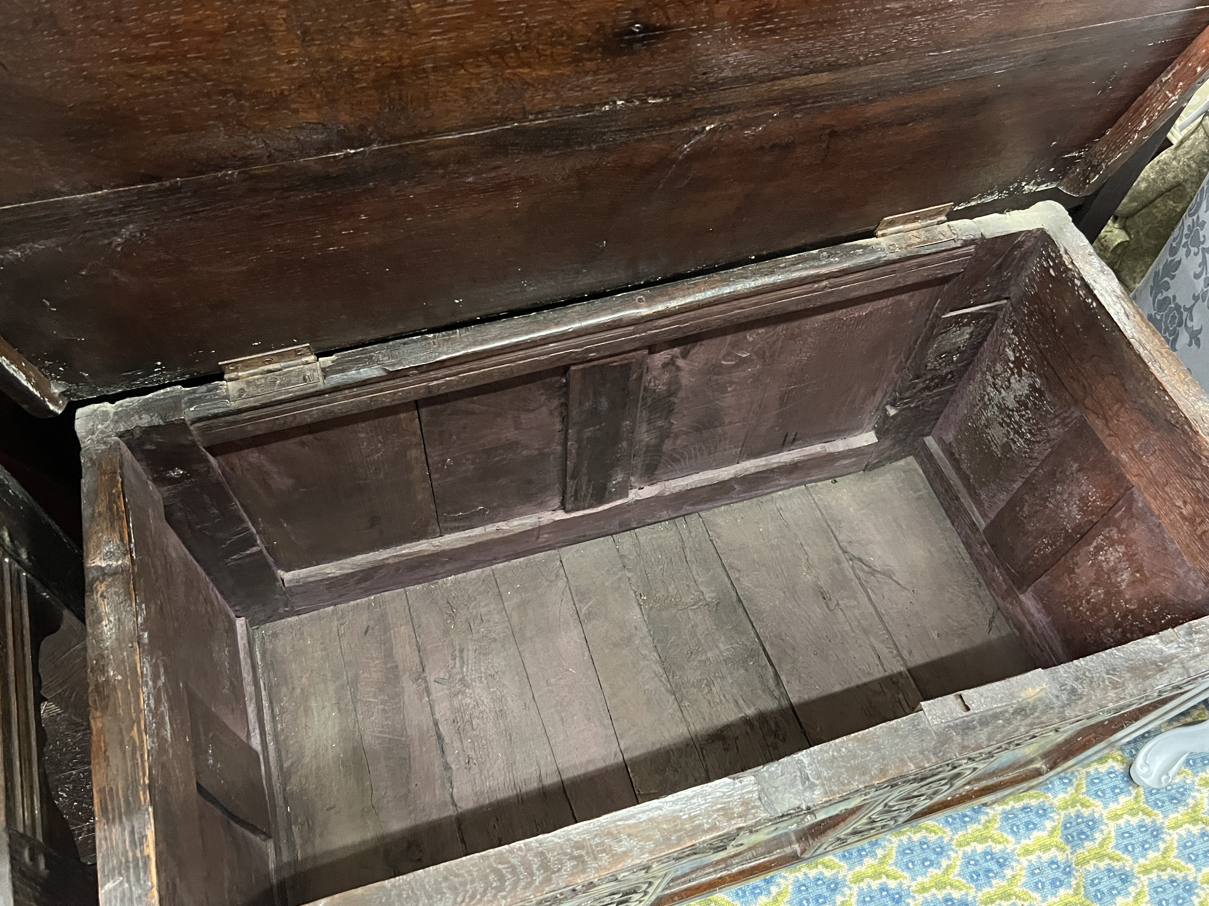 A 17th century oak coffer, width 102cm, depth 48cm, height 63cm